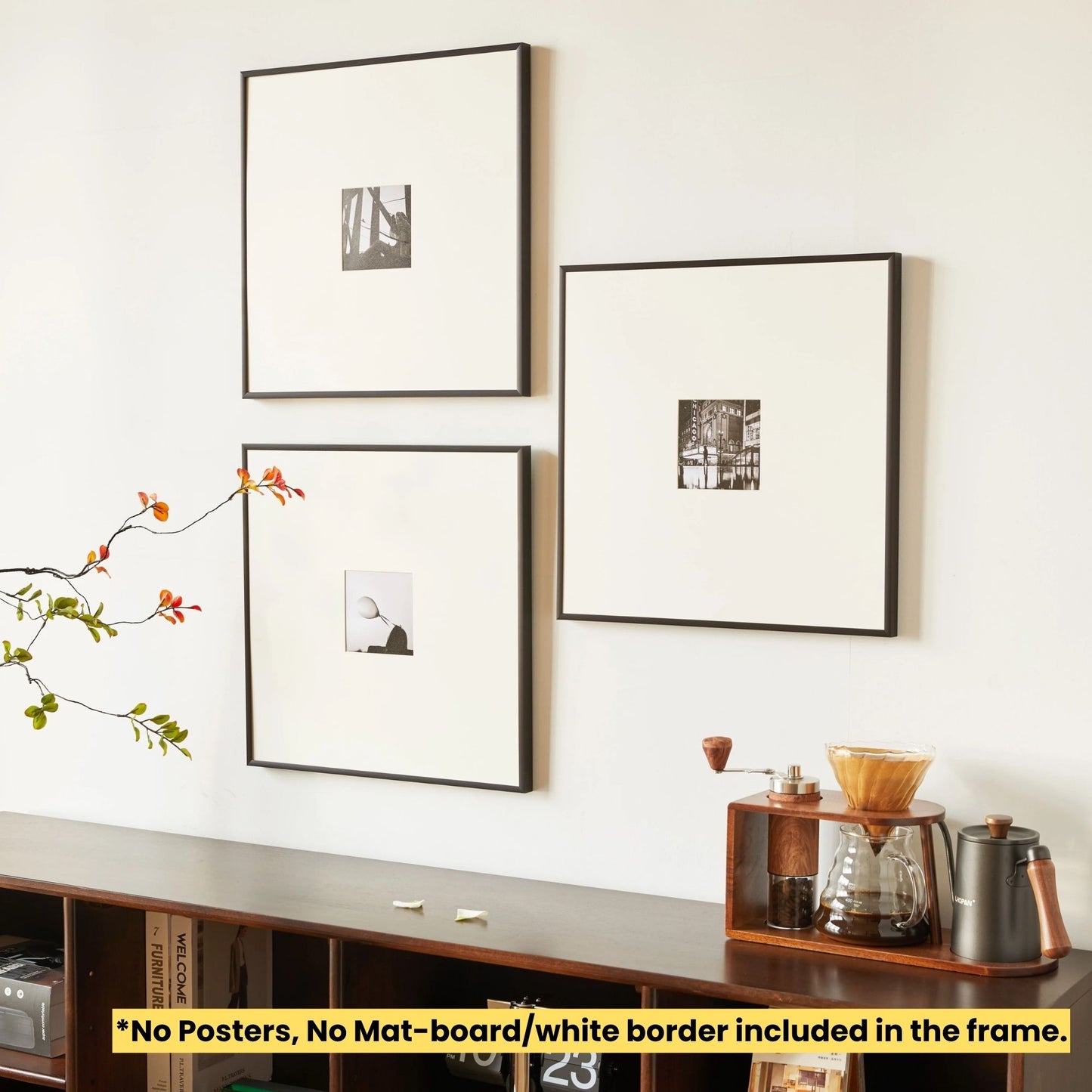 Three framed pictures on a wall above a wooden shelf with a coffee grinder and kettle. SET OF 3 - Thin Aluminum Premium Black Premium Metal Photo Frame 60x60 CM